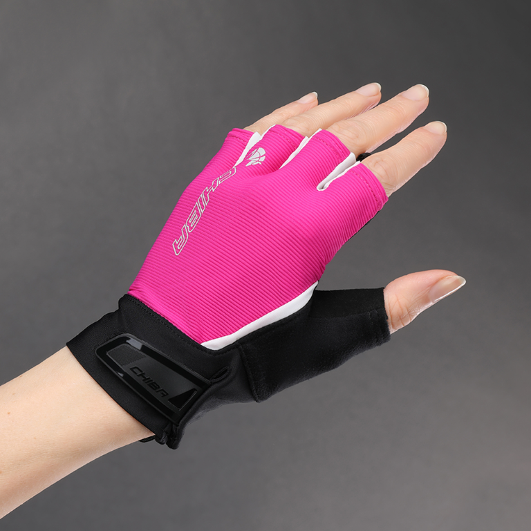 Hand wearing CHIBA cycling glove gripping handlebar